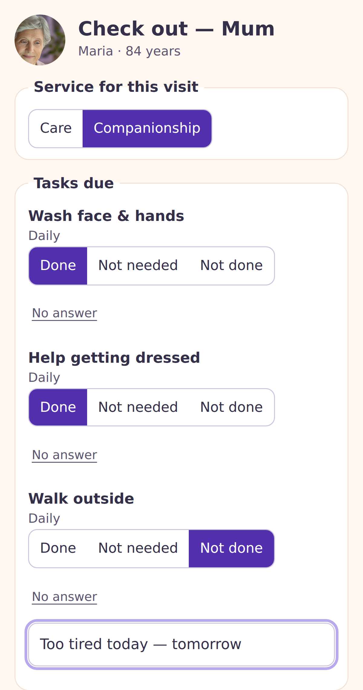 Carer ticking off tasks at the end of a visit